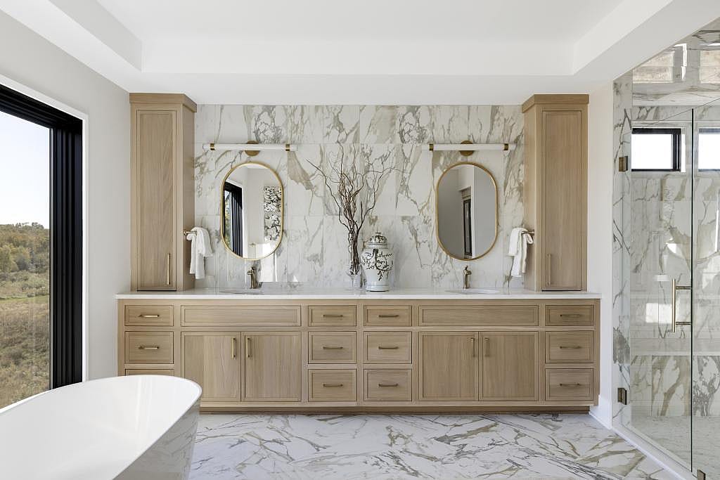 Modern bathroom with a long vanity cabinet storage.
