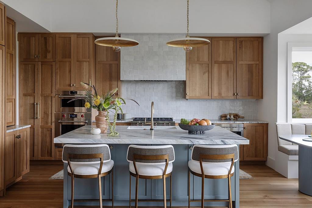Modern luxury kitchen with cabinet storage up to the ceiling.