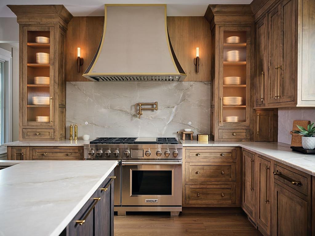 Modern luxury kitchen with interior cabinet lighting.