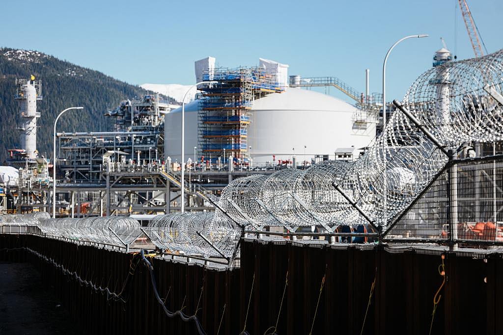 View outside the gate with concertina wire enclosing the $40-billion LNG terminal whose construction took around five years, connecting British Columbia shale gas reserves to pan-Pacific shipping routes.
