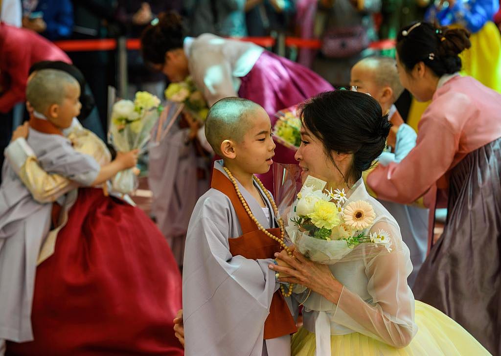 A child monk with his mother at Jogye Temple in Seoul, South Korea. 