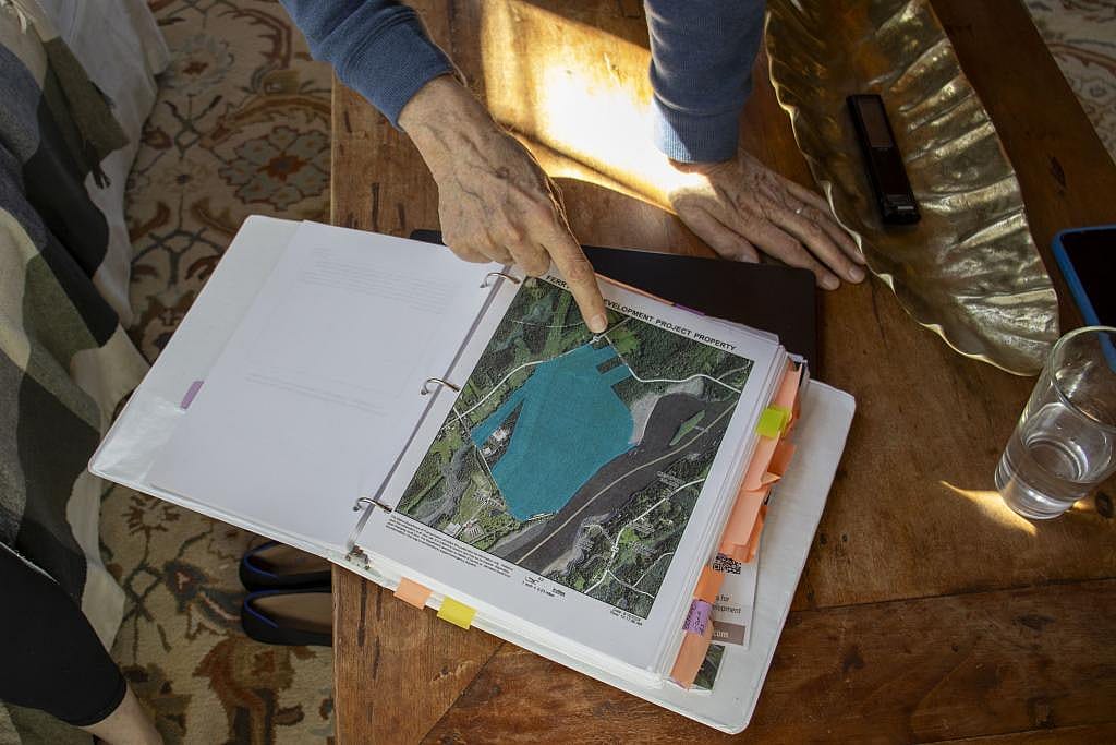 Members of the Protect Wiscasset group show a map of the Old Ferry Road property, 300 acres of town-owned land acquired from Maine Yankee Atomic Power Company in the early 2000s.