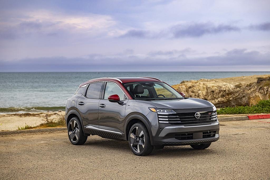 A 2026 Nissan Kicks car parked by the seaside.