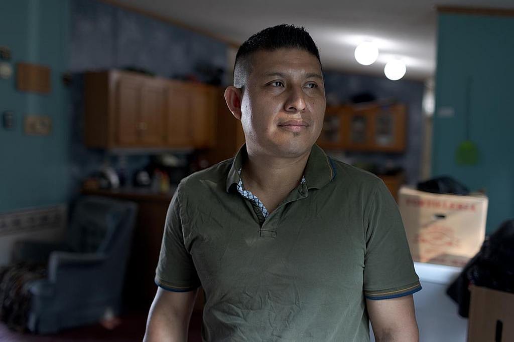José Edilberto Molina-Aguilar in the trailer where he lives next to a large-scale dairy farm where he works in rural Vermont. After a month in a detention center in Texas, Molina-Aguilar was released, but his asylum case is still pending. He now wears an ICE ankle monitor.