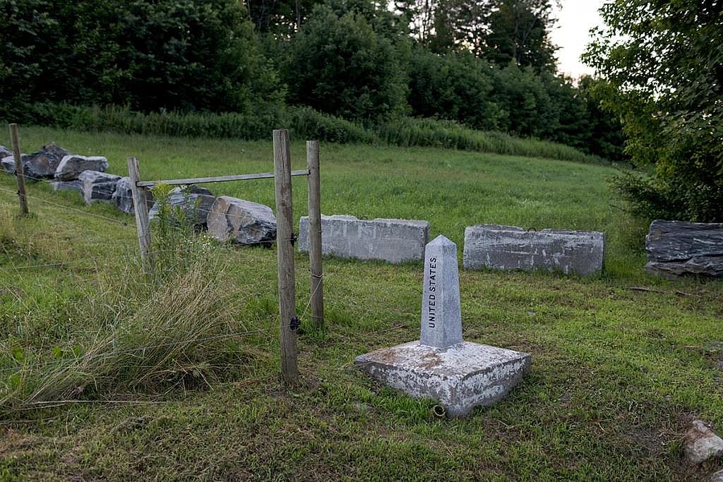 A concrete obelisk marks the border between the US and Canada in Vermont in July.