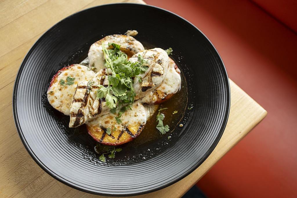 A summertime favorite, halibut and peaches, celebrates local, seasonal halibut, and Pacific Northwest peaches.