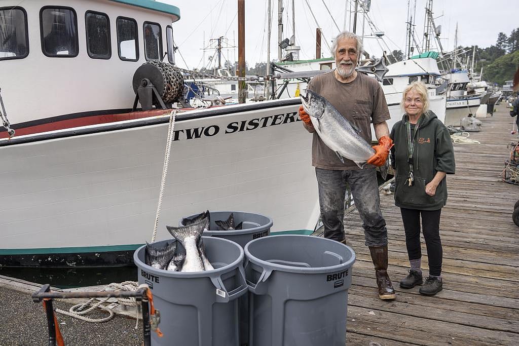 Newport fisherman Larry Davis and Local Ocean fishmonger Amber Morris. Local Ocean is buying Davis’ whole catch of Chinook salmon this season.