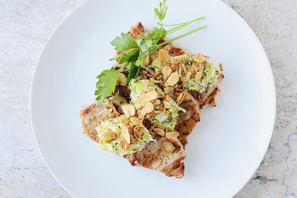 A plate of Korean Chili Pork Chops dish.