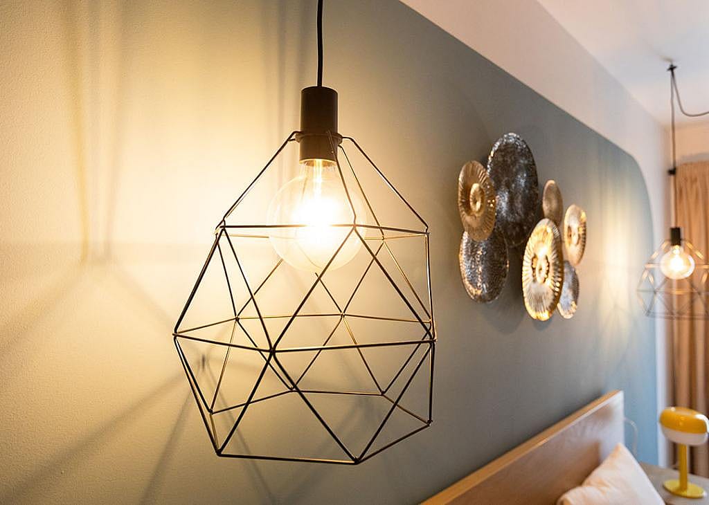 Modern industrial and geometric pendant light for indoor lighting.