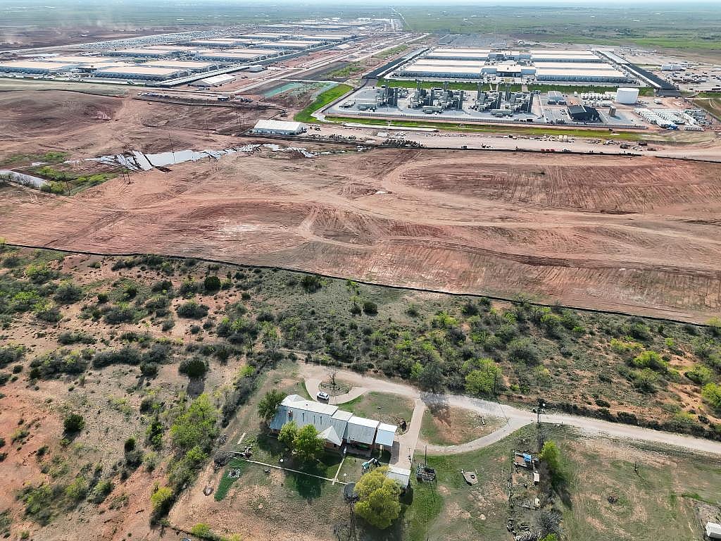 Aerial view showing Garcia’s home next to OpenAI’s flagship Stargate data center and its accompanying gas plant.