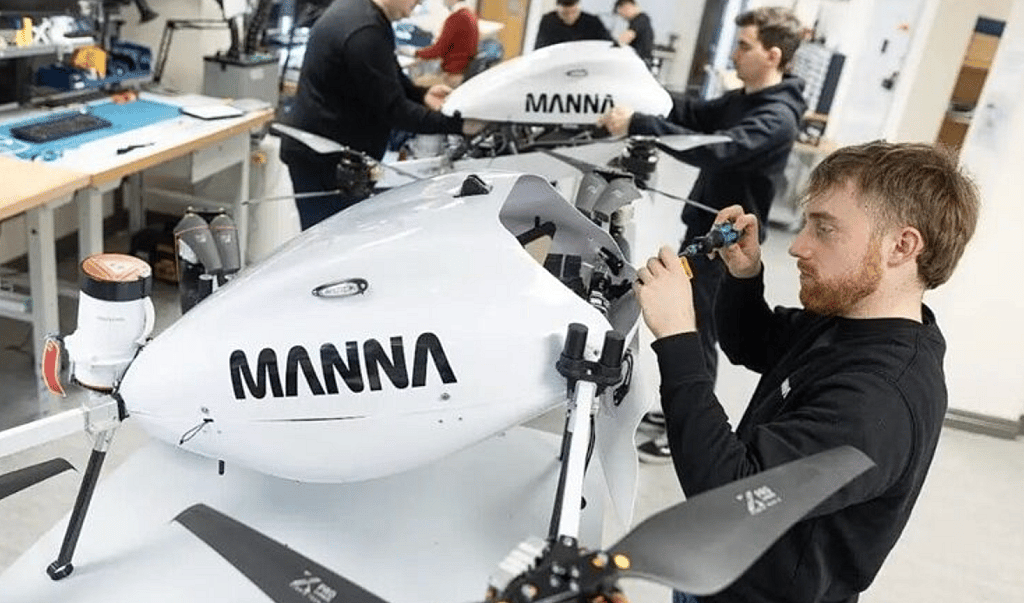 An engineer works on a Manna drone.