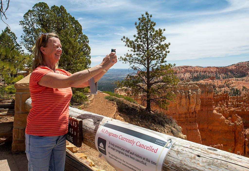 Alese Rhodes from Tri-cities, Washington takes photo at Sunset Point, at Bryce Canyon National Park, Wednesday May 6, 2020.