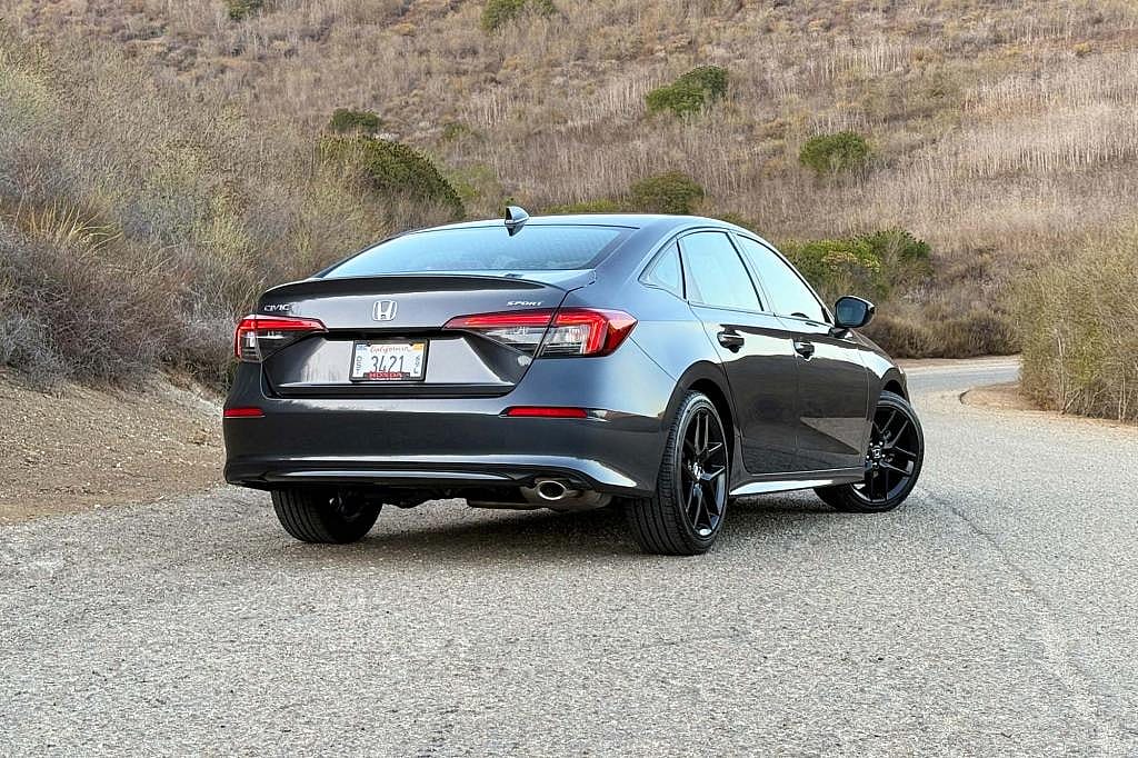 Rear three-quarter view of a 2026 Honda Civic sedan.
