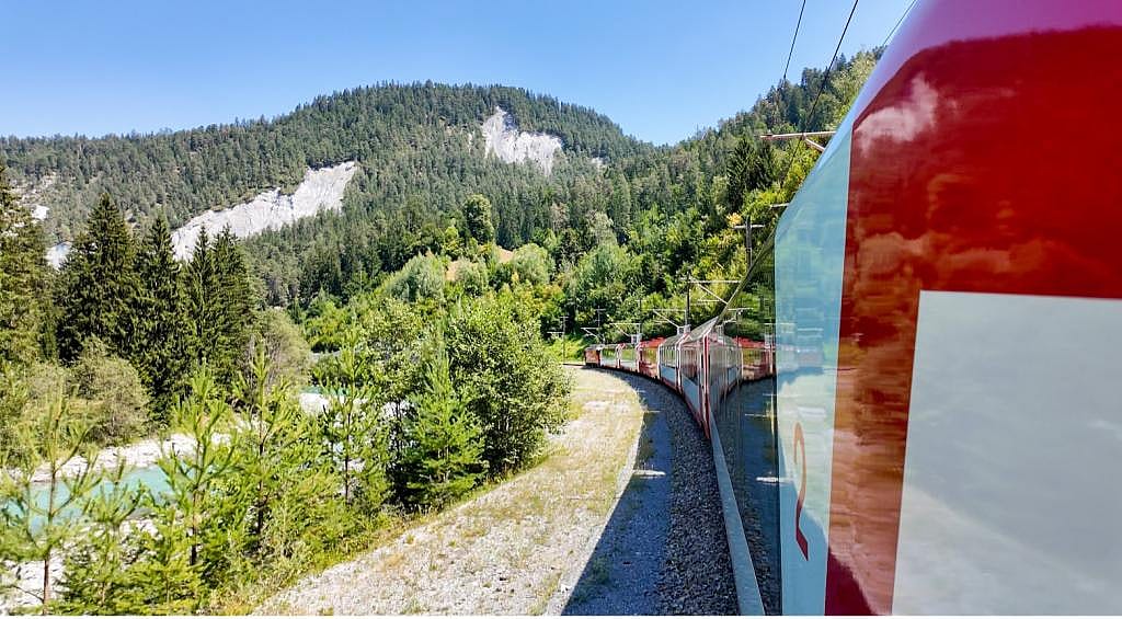 An express train carrying passengers to high-altitude adventures to Europe's scenic mountain ranges.
