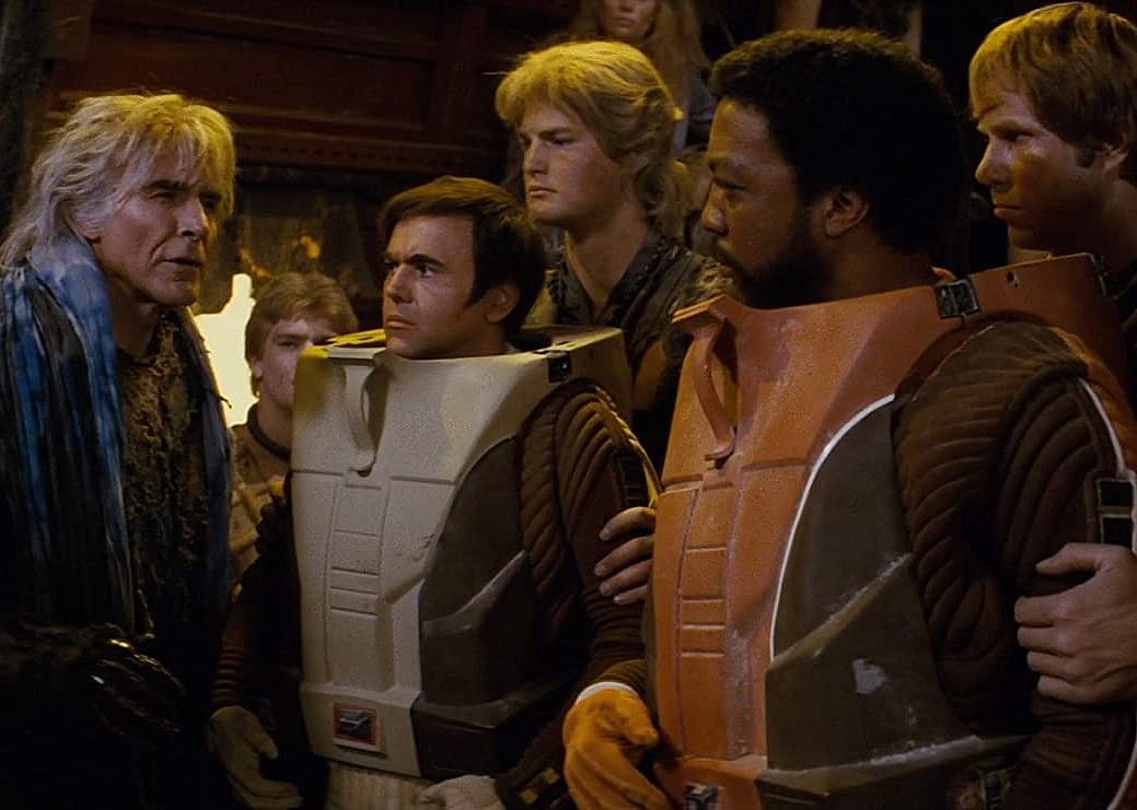 A group of people in space gear.