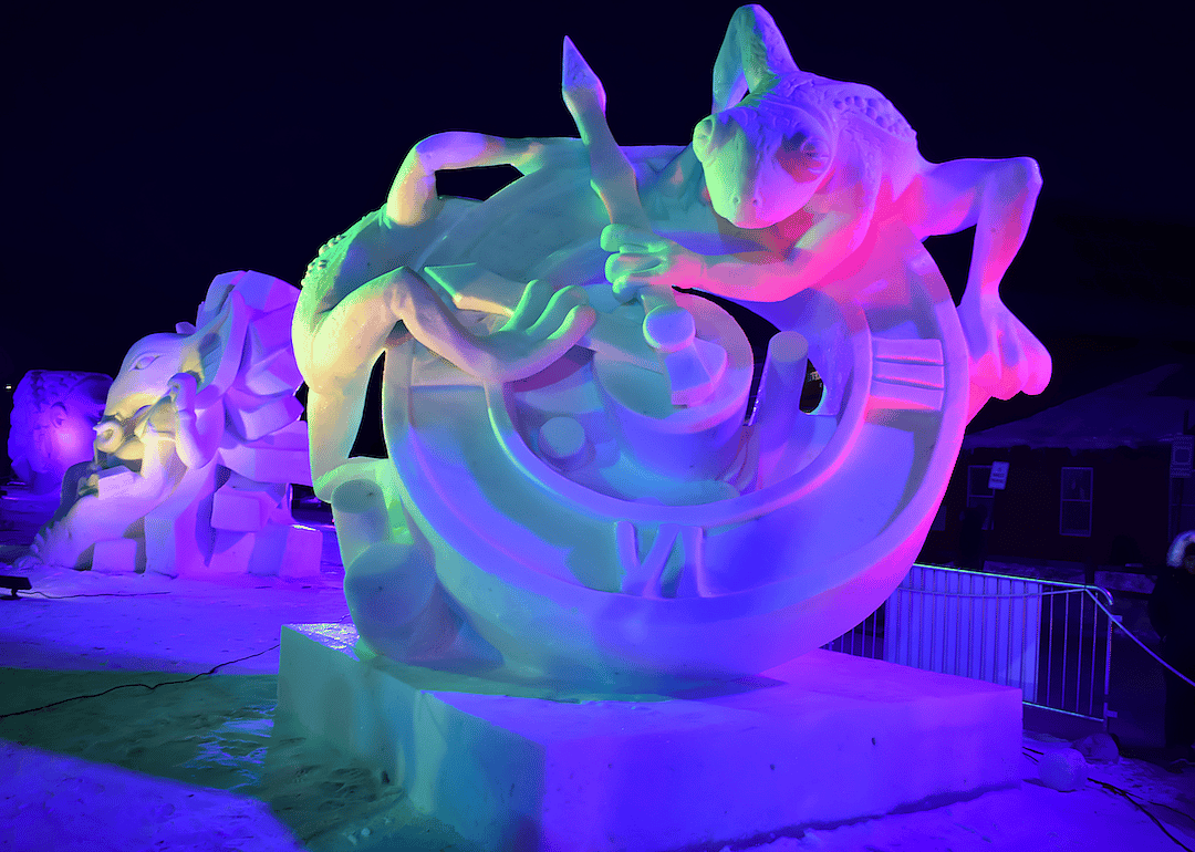 Frogs on a clock snow sculpture in Breckenridge, Colorado