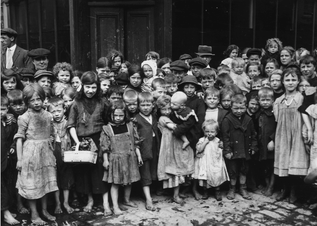 Children wait for food handouts during London's dock strike