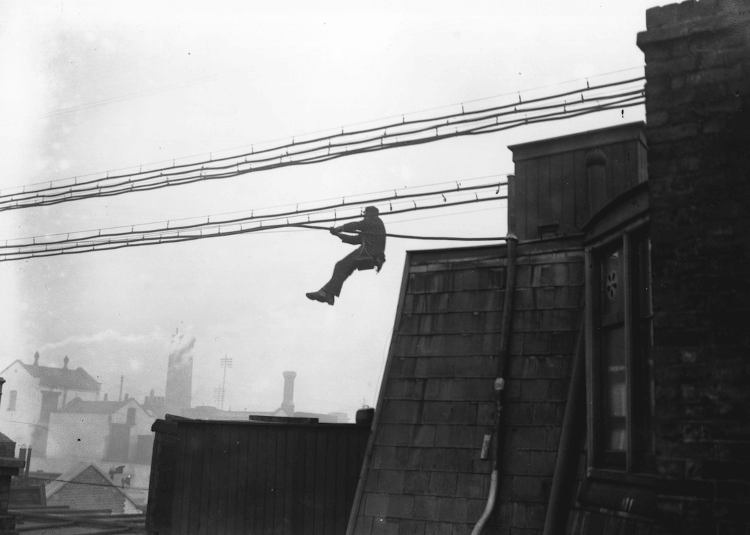 Engineer fixes telephone lines on Fleet Street