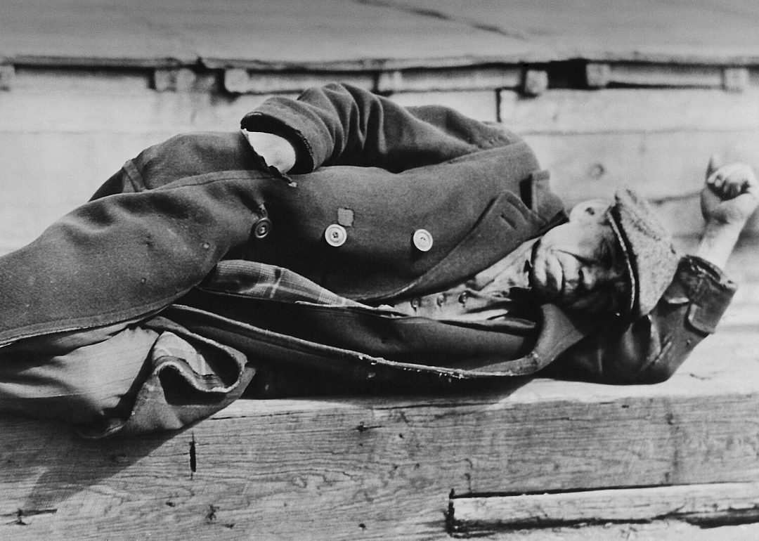 Man sleeps on New York City docks in 1930 or 1931