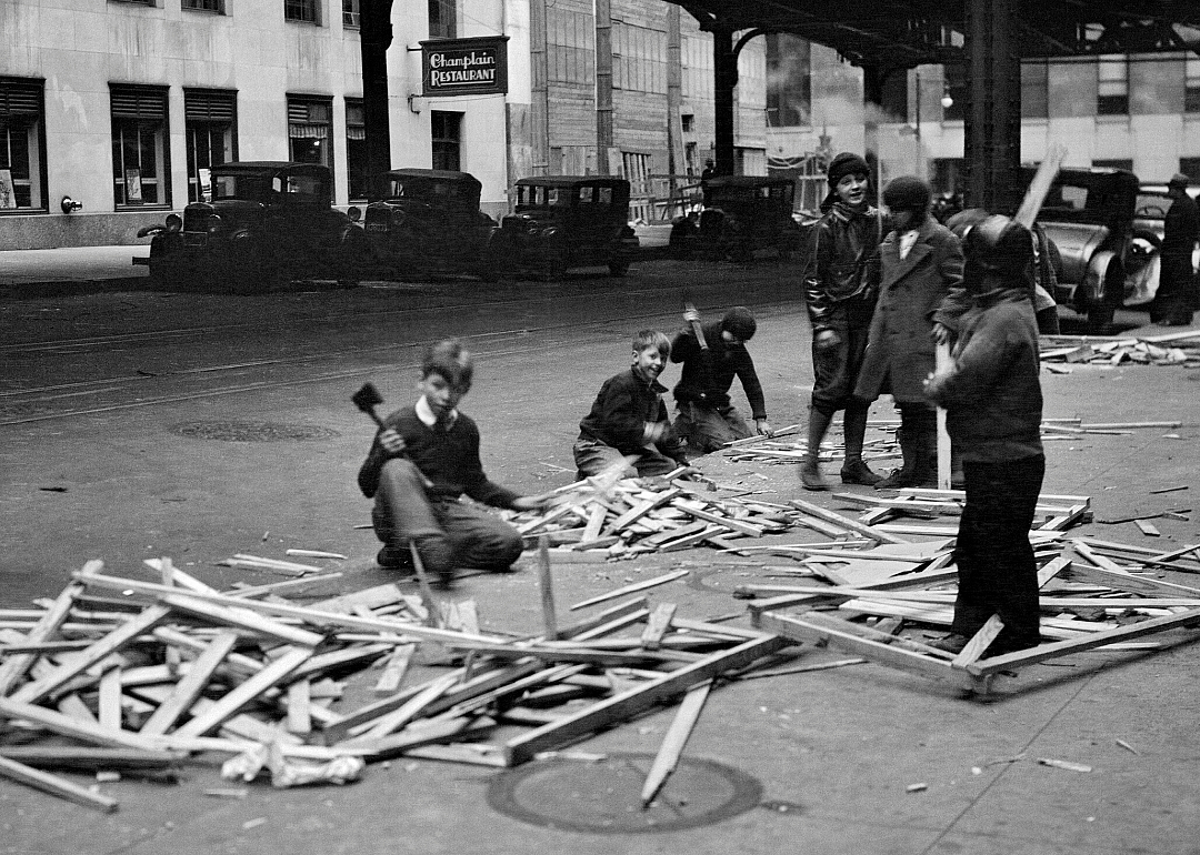 Children take apart packing boxes for stove fuel in New York City in 1931
