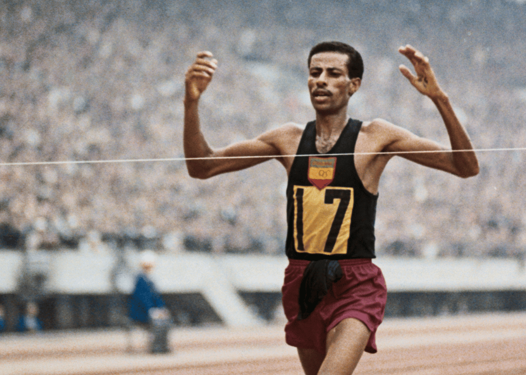 Abebe Bikila wins his second Olympic marathon in record time