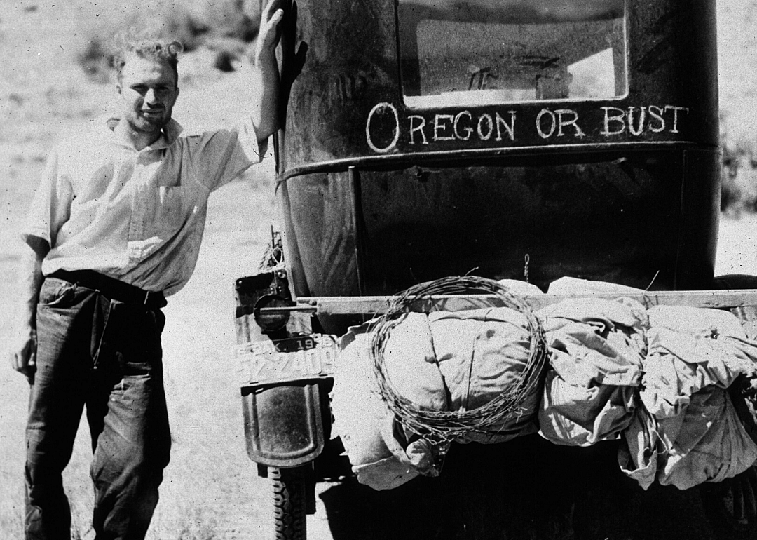 Vernon Evans stands next to his car in Montana in 1936