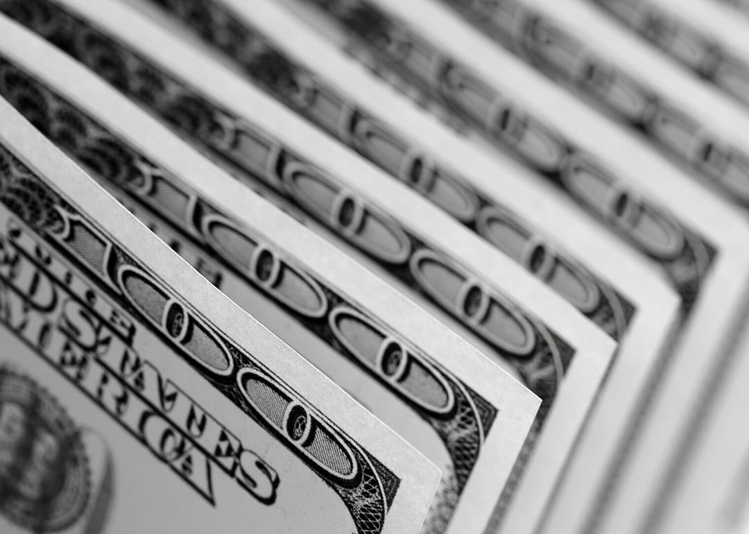 Hundred dollar bills in a row.
