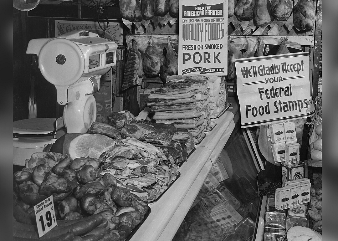 Food market display of signs welcoming the use of food stamps
