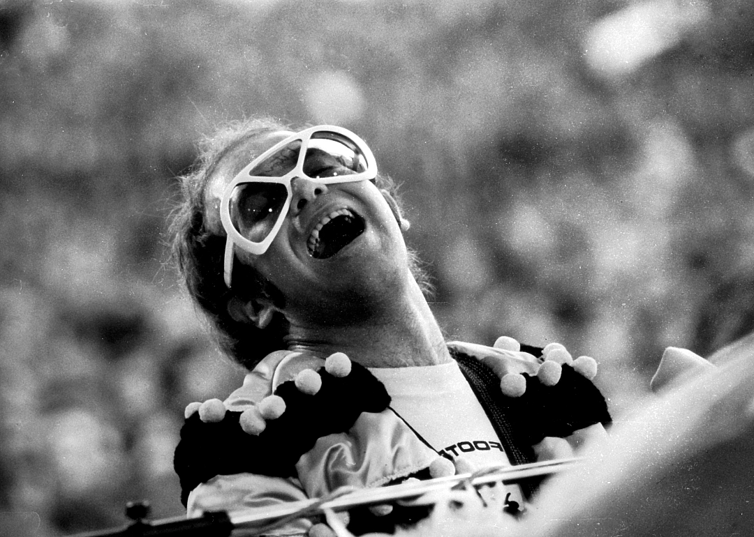 Elton John performs on stage.
