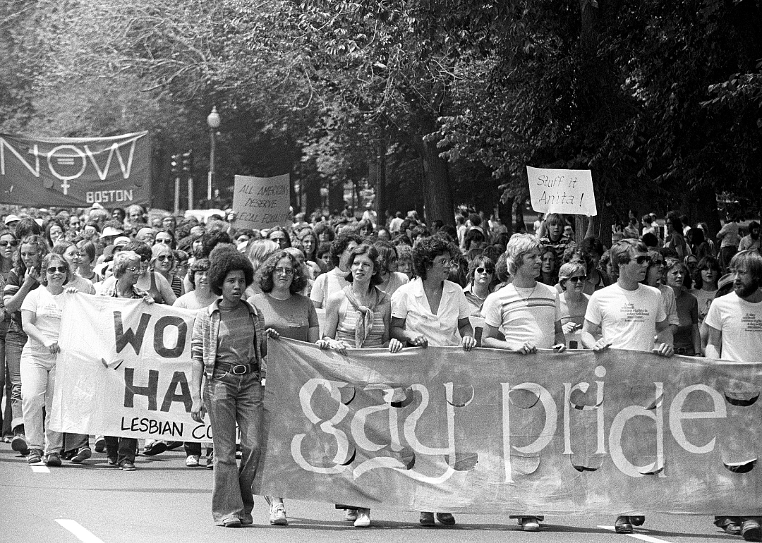 People walking in pride parade.