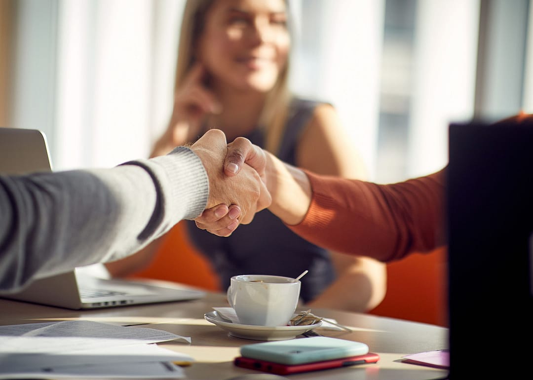 People shaking hands in a relaxed atmosphere.