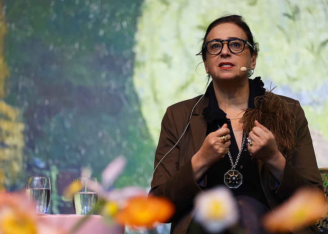 India Mahdavi speaks at event.