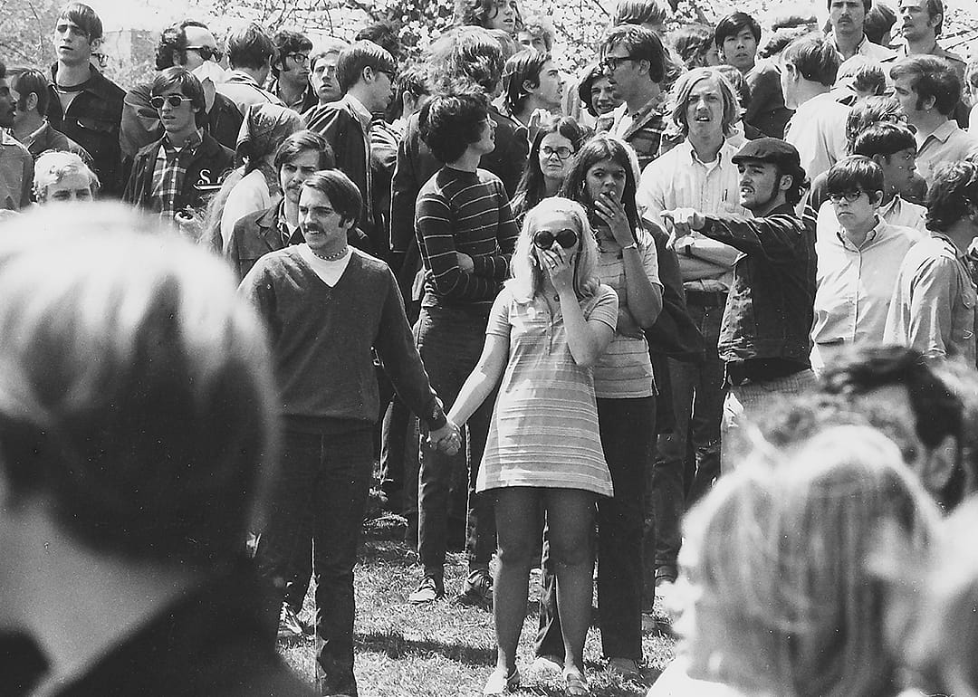 Students at Kent State University staring in the aftermath of the shooting.