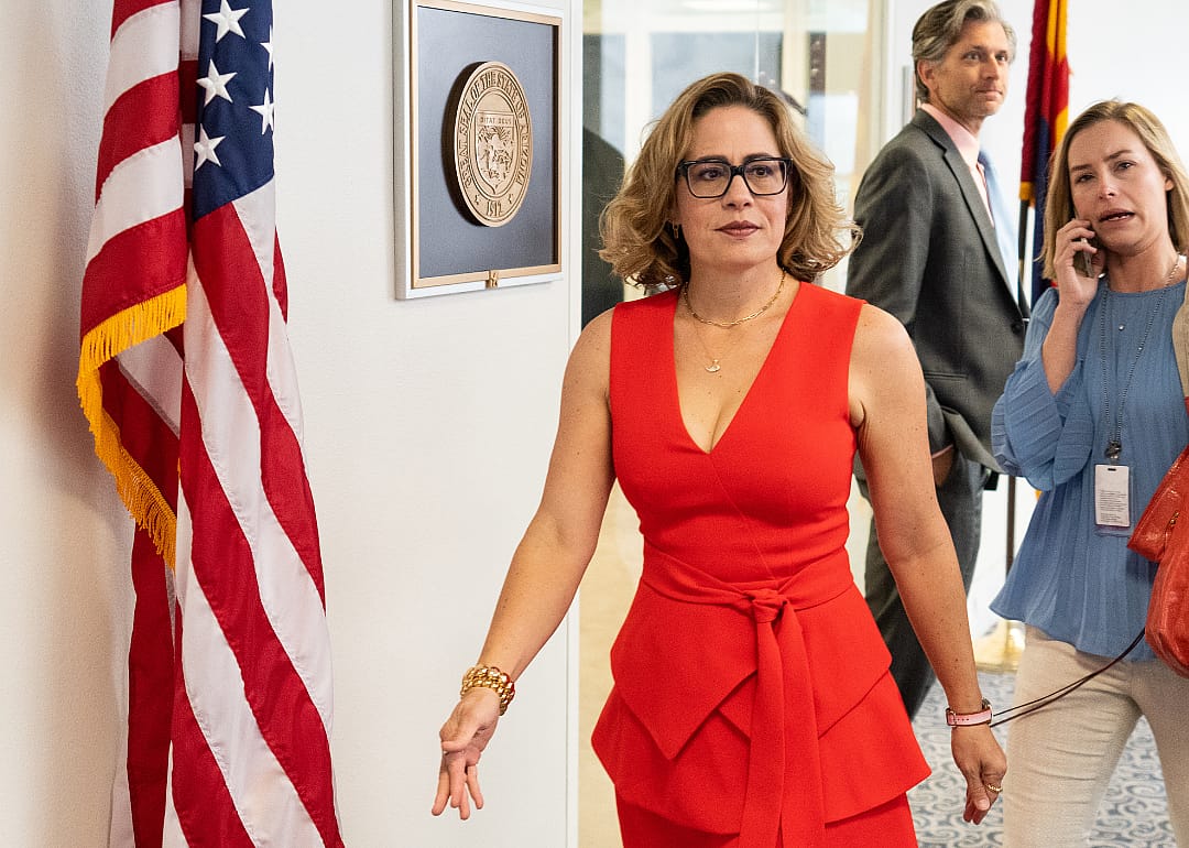 Senator Kyrsten Sinema leaving a meeting.