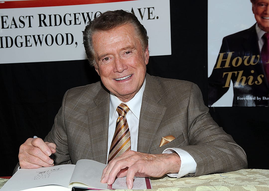 Regis Philbin signs his book, How I Got This Way, at a promotional event.