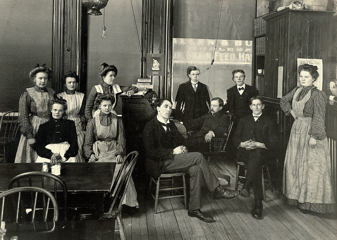 Waiters and waitresses pose for a group picture