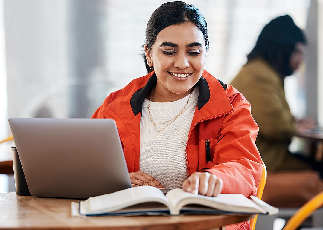 Student working on research project in library.