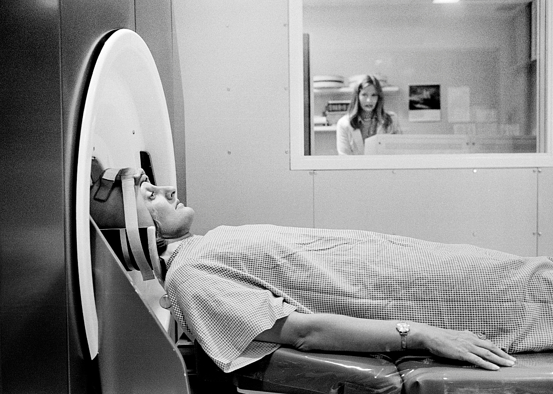 Patient ready to receive CAT scan in medical facility.