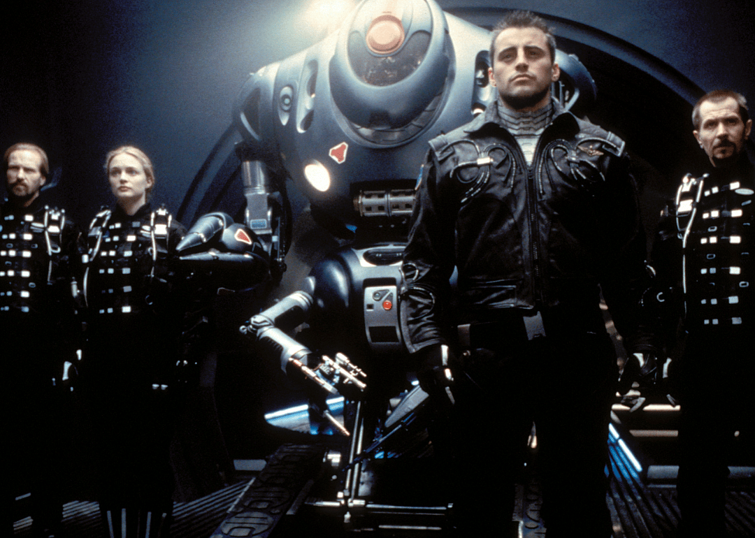 Gary Oldman, William Hurt, Heather Graham, and Matt LeBlanc in a scene from ‘Lost in Space’.