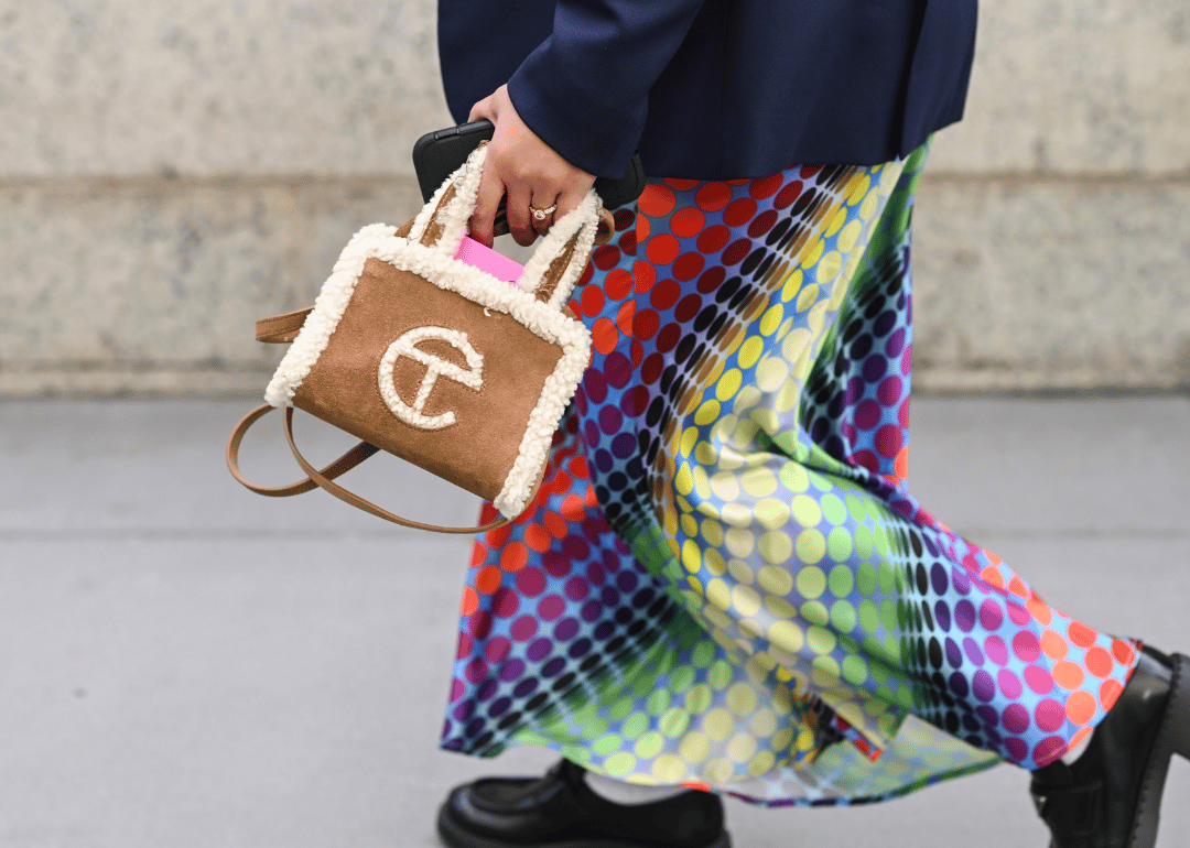 Person walking with Telfar bag.