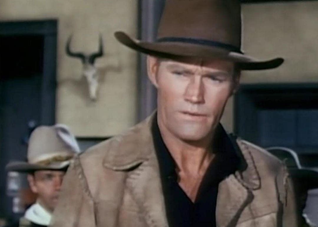 A man in a cowboy hat.