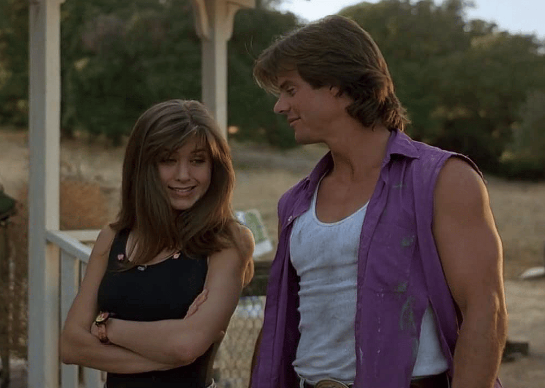 Jennifer Aniston and Ken Olandt in a scene from ‘Leprechaun’.