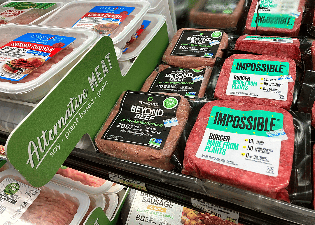 Beyond Meat and Impossible Foods burgers in supermarket.