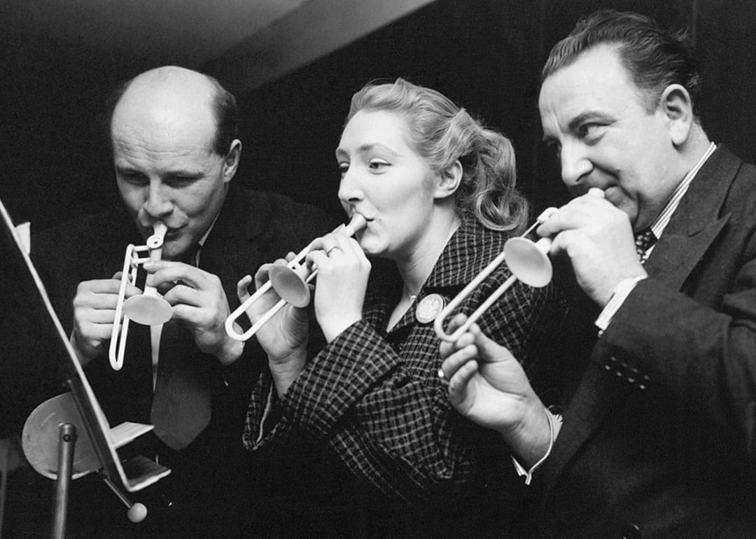 Musiccians rehearse on their tiny instruments for an April Fool's Day performance of the 'Toy Symphony’ at Royal Festival Hall in London.