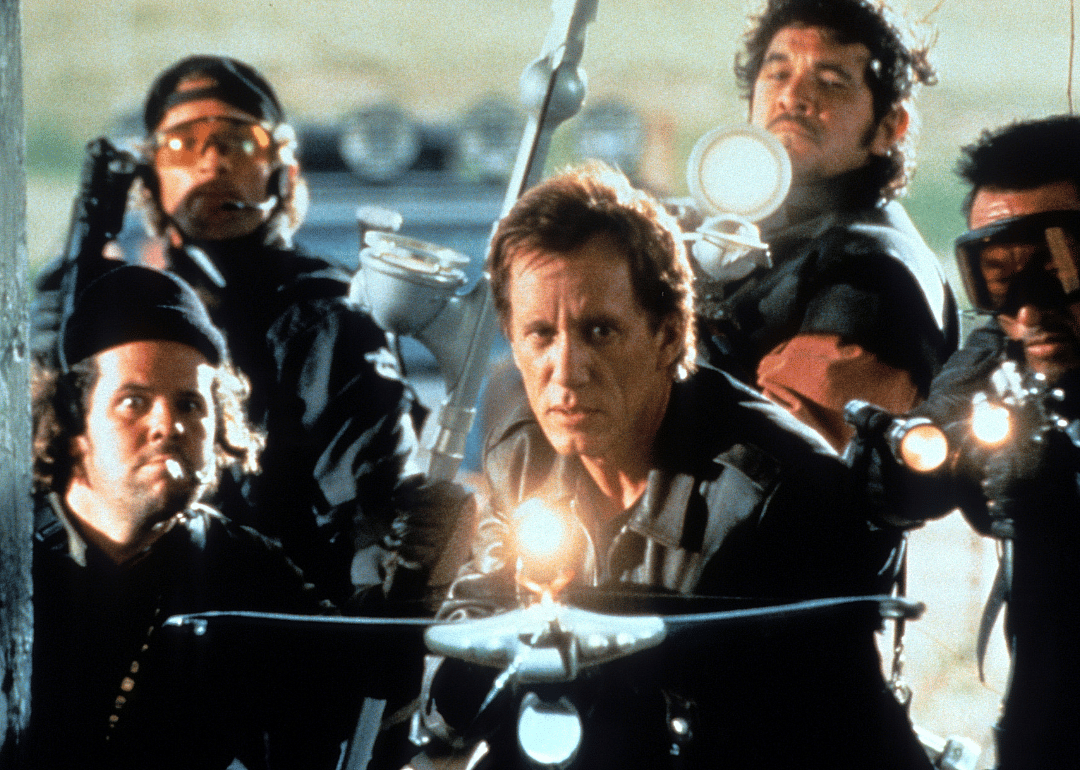 James Woods holds a crossbow with his crew in a scene from the film 'Vampires.'