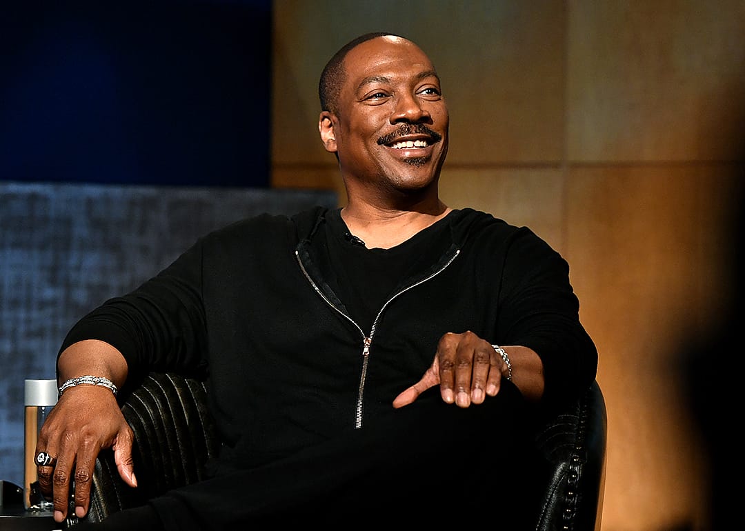 Eddie Murphy speaks onstage during event.