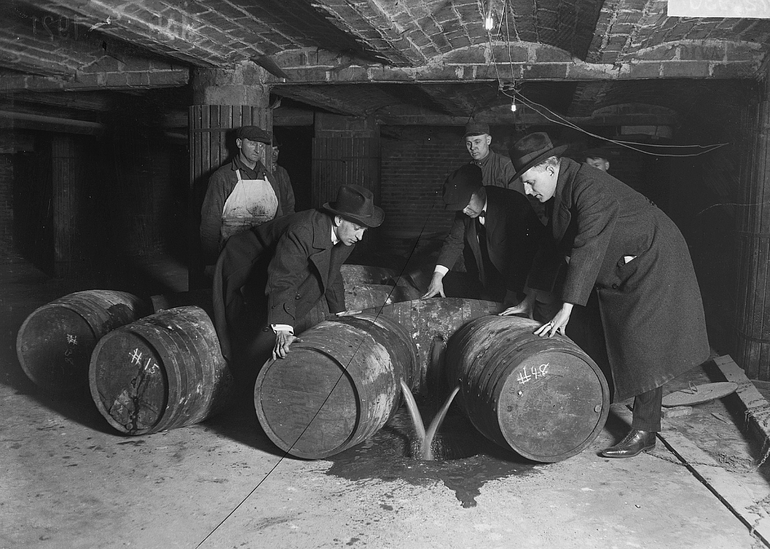 Men dumping wine during prohibition