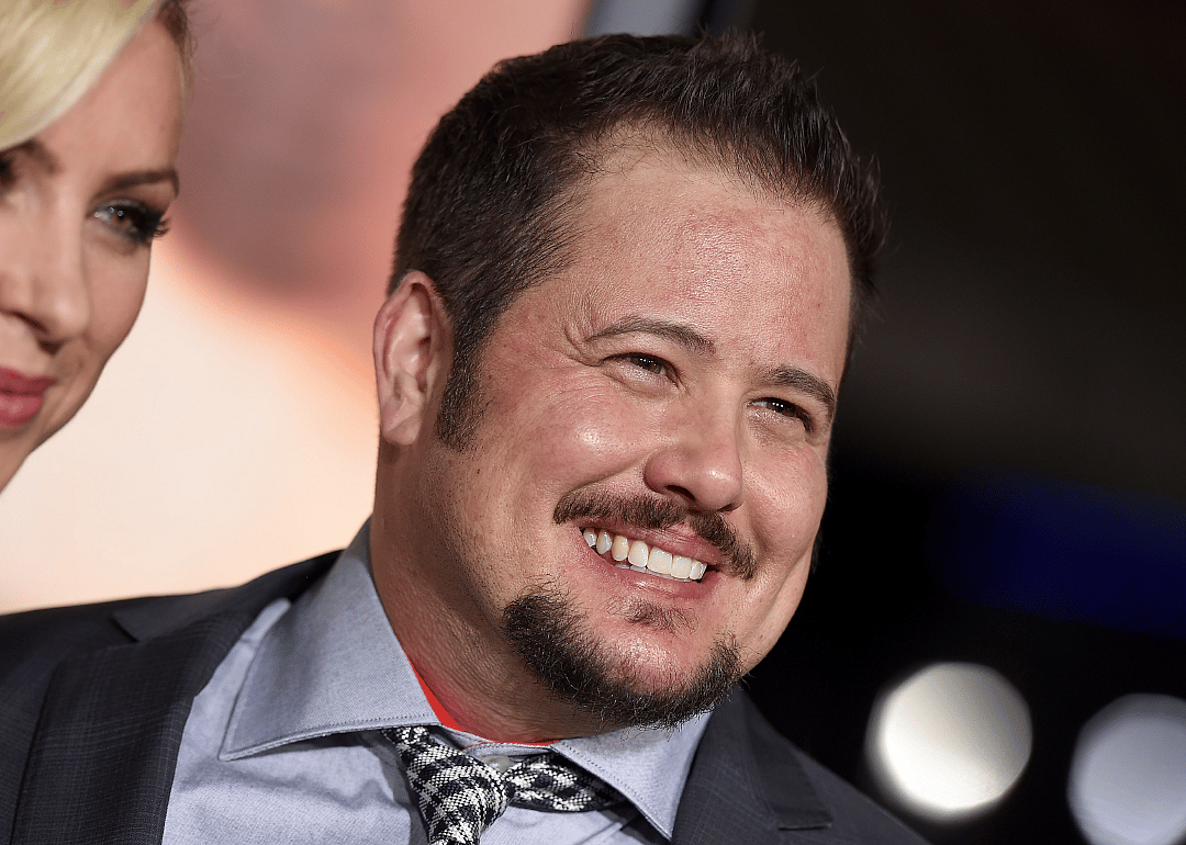 Chaz Bono smiles at event.