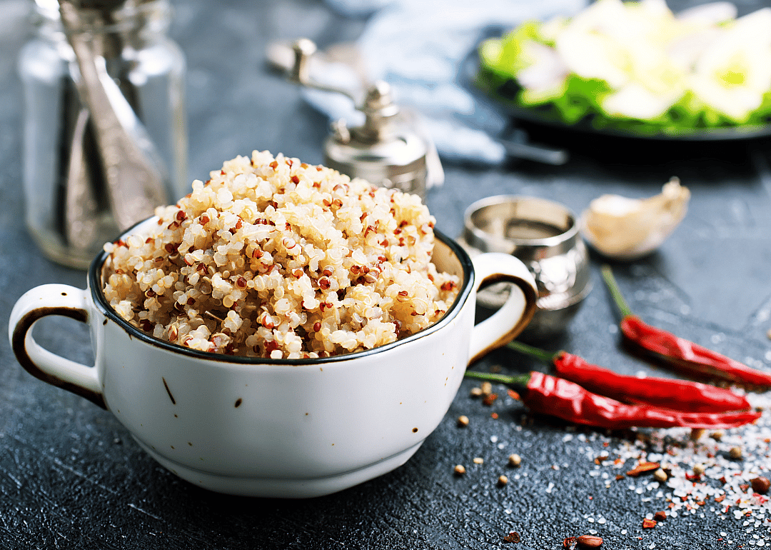 Quinoa in bowl on table.