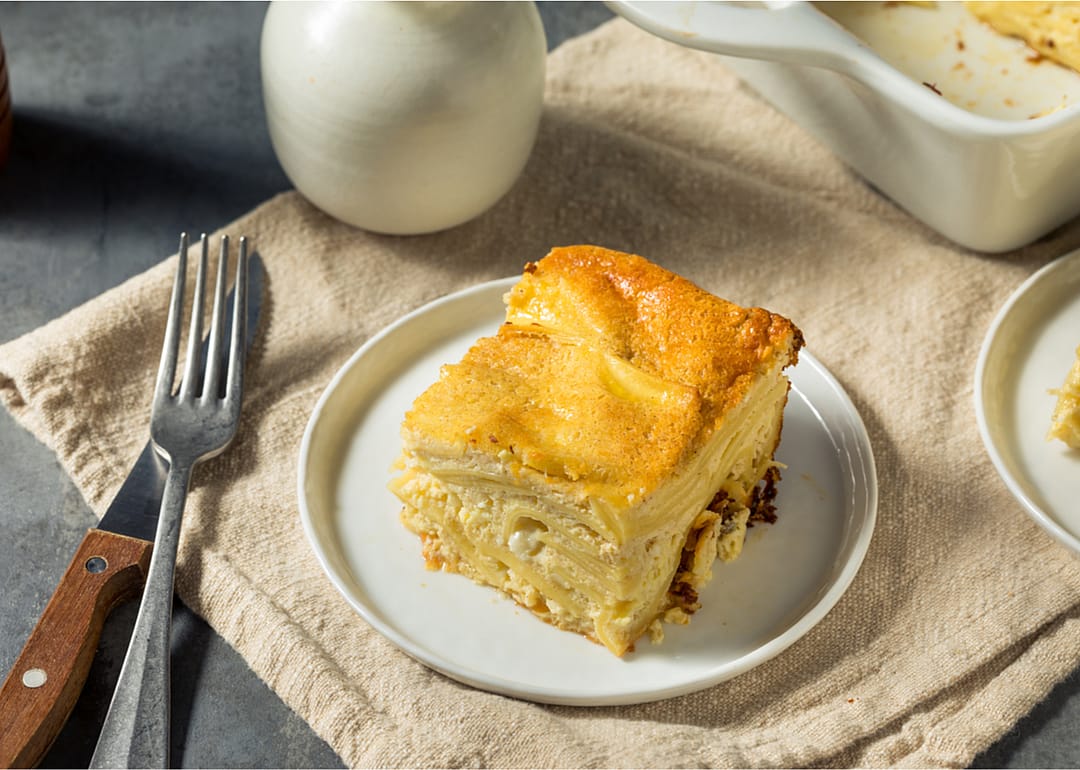 A slice of kugel on a plate.
